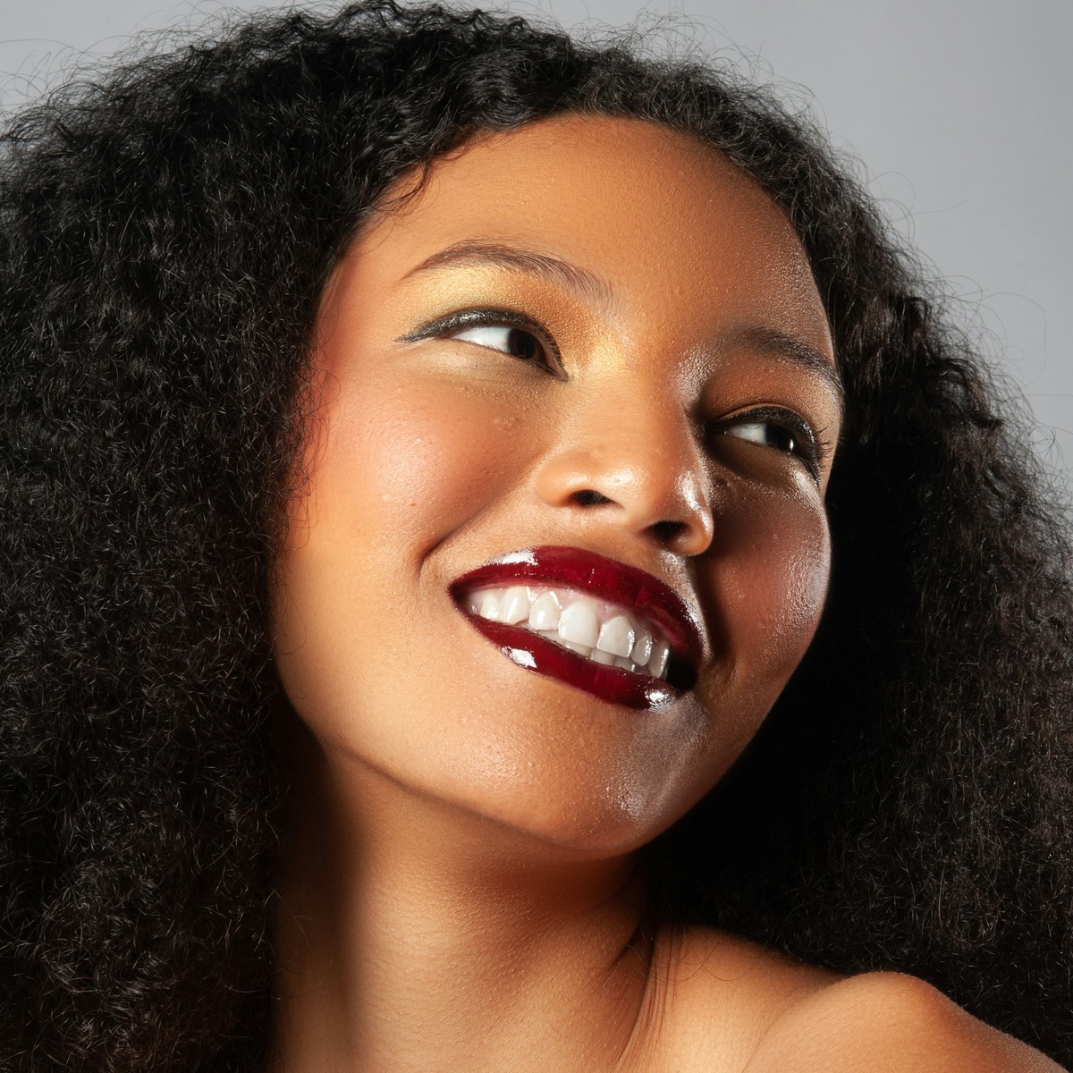Portrait of a smiling woman with radiant, healthy-looking skin